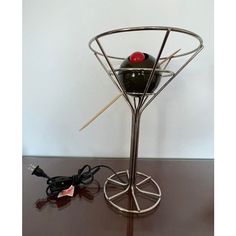 a table that has some kind of device on top of it with wires attached to it