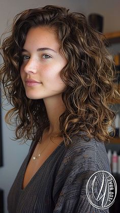 Layered haircuts have long been an all-time favorite as they complement various hair types and lengths without sacrificing versatility or stylishness. With the right layers, anyone can add volume, texture, and flow to their hair, Layered Lob Curly Hair, Perm On Shoulder Length Hair, Round Wavy Haircut, Short Curly Haircuts Shoulder Length, Haircut Wavy Curly Hair, Curly Collarbone Length Hair, Layer Curly Haircut, Curly Mom Haircut, Haircut For 2c Hair