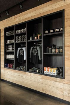 the inside of a store with wooden walls and shelves