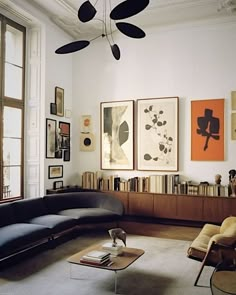 a living room filled with furniture and art