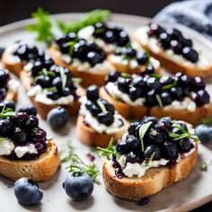 small crostini with blueberries and cream cheese on a plate