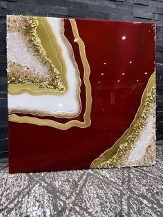 a large red and gold glass block