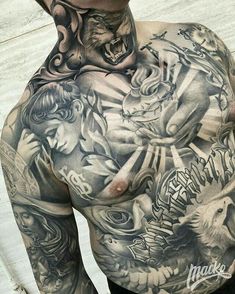 a man with many tattoos on his chest