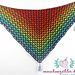 a multicolored triangle with tassels hanging from it