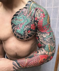 a man with tattoos on his arm and chest