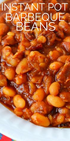 a white plate topped with beans on top of a table