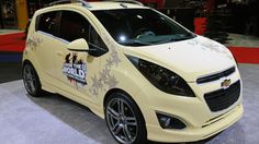 the chevrolet spark is on display at an auto show