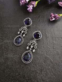 Stunning Unique Victorian earrings with beautiful purple CZ stones and rhodium plating. Made with highest quality CZ stones and expert craftsmanship. Length - 3 inch Width - 1 inch Weight - 15 gm each ----------- CARE ----------- - Store in air tight zip lock bags - Do not expose to moisture/water - Do not spray chemicals or perfumes on the jewelry Please feel free to contact us if you have any questions. * We sell high quality imitation jewelry only. All measurements are approximate. Please note that all sales are final. Thank you Purple Drop Chandelier Earrings For Formal Occasions, Formal Purple Diamond Earrings, Luxury Purple Earrings For Anniversary, Elegant Purple Pierced Earrings, Elegant Purple Dangle Chandelier Earrings, Silver Diamond Gemstone Earrings For Evening, Elegant Purple Gemstone Chandelier Earrings, Purple Crystal Drop Earrings For Evening, Purple Drop Crystal Earrings For Evening