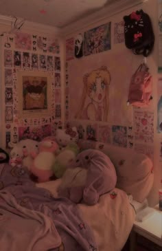 a bedroom with many stuffed animals and pictures on the wall