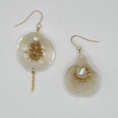 All seashell earrings are hypoallergenic and handmade. This pair features natural seashells, "caviar" balls, and 18K gold-plated findings.    🐚Natural seashells from the ocean 🌊  ✨ Non-tarnish, hypoallergenic gold-plated findings  👂Great for sensitive ears 💛Nickel and lead-free 🫶🏼Crafted slowly and with love - Our Products - We work with high-quality, natural materials that stand the test of time. Since each piece is handmade with natural materials such as freshwater pearls, stone beads, and seashells, no jewelry is completely alike. Color, shape, and size of shells and beads will look slightly different in each piece. - Materials -  Stainless Steel (When Possible) Our jewelry is made from stainless steel with a gold coating process called PVD (physical vapor deposition). This makes Handmade Pearl Shell-shaped Earrings, Handmade Pearl Earrings In Shell Shape, Dangle Shell Pearl Earrings, Handmade Shell Pearl Dangle Earrings, Handmade Dangle Pearl Earrings With Shell, Handmade Dangle Pearl Earrings, Handmade Pearl Earrings For Summer, Handmade Shell Pearl Drop Earrings, Handmade Gold Pearl Earrings For Summer