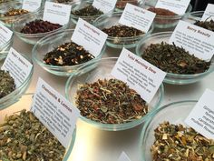 many bowls filled with different types of herbs