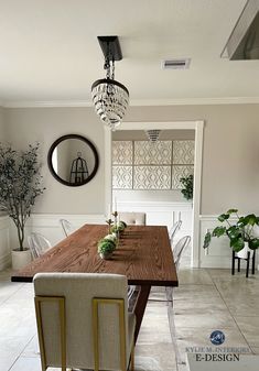 a dining room table with chairs and a chandelier hanging from it's ceiling