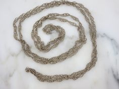 "A wonderful vintage long chain necklace with twisted wire links in silver tone metal. It is a Mexican wedding necklace, which would be worn around both the bride and groom while they saw their vows. No marks. Measures about 71\" long. Lots of tarnish and wear, I have not tried to clean or polish. Actual packaging will vary depending on item/s purchased and tape pattern available. Props shown in photos is for display purposes only, not included in this listing. As always, satisfaction is guarant Silver Rope Chain, Tape Pattern, Unique Brooch, Mexican Wedding, Twisted Wire, Long Chain Necklace, Chain Necklaces, Necklaces For Women, Long Chain