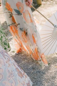 Outdoor Wedding Decor Trends for Summer and Beyond | The Scout Guide, wedding guest in a dress with sun umbrella