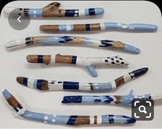 five toothbrushes with different designs on them