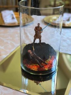 a star wars scene in a glass on a table