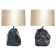 two lamps made out of rocks on a white background