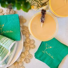 the table is set with green and yellow napkins