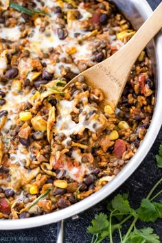 a skillet filled with mexican food and garnished with cilantro