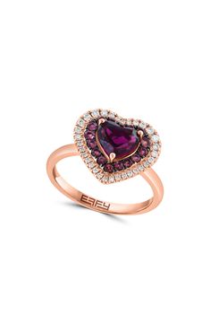 Elevate your look with a sentimental ring featuring rows of sparkling diamonds and pink tourmaline to frame a heart-cut rhodolite garnet set in fine 14k-gold. 14k-rose gold/rhodolite garnet/pink tourmaline/diamond Total diamond weight: 0.21ct Made in the USA Diamond Guide Rhodolite Garnet Jewelry, Garnet Heart, Diamond Guide, Garnet Jewelry, Rose Gold Pink, Rhodolite Garnet, Affordable Jewelry, Diamond Halo, Sparkle Diamonds