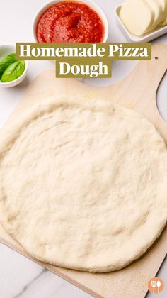 the dough is ready to be made into pizza crusts and other ingredients are on the counter