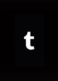 a black and white photo with the letter t in it's center, on a dark background