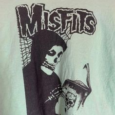 Band: misfits  Size:  16" pit to pit  &      20" collar to bottom  Colors: green Condition: excellent  Date : 7/30/24 **all of our shirts are PRE-OWNED and may contain normal wear, fading, stains or imperfections, holes, tears, loose or missing threads. We will do our best to point out significant issues. Thank you for looking!! #tshirt #fashion #clothing #streetwear #shirt Green Halloween T-shirt For Streetwear, Green Punk Style T-shirt For Streetwear, Green Band Merch Tops For Concert, Green Concert T-shirt With Screen Print, Green Graphic Tee For Concert, Green Cotton Grunge T-shirt, Green Crew Neck Top For Concert, Green Band Merch T-shirt For Fans, Green Punk Crew Neck T-shirt