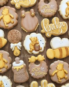 some cookies that are decorated to look like winnie the pooh and other things on display