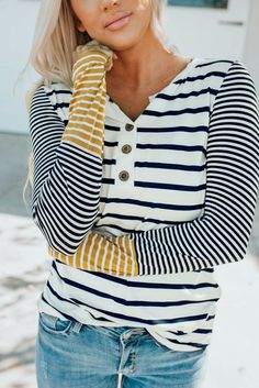 Long sleeve henley top with large stripes white with black on body of shirt. On sleeves it has small stripes in white with black from shoulder 3/4 down and rest is a mustard yellow with white stripes. Not a loose shirt not real tight but more fitted. Color Block Top, Contrast Collar, Henley Top, Casual Blouse, Drop Shipping, Sleeves Pattern, Long Sleeve Casual, Easy Wear, Long Tops