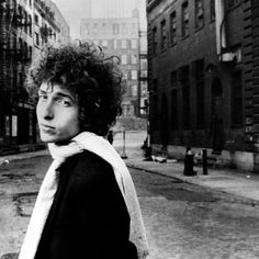 black and white photograph of a man with curly hair