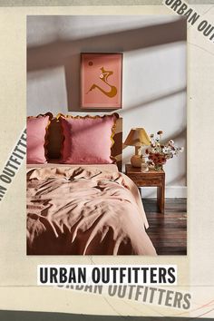 an advertisement for urban outfitters featuring a bed with pink comforters and matching pillows