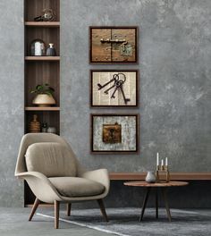 a living room with three framed pictures on the wall and a chair next to it