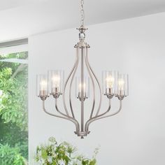 a chandelier with five lights hanging from it