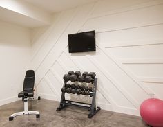 there is a tv and exercise equipment in the room