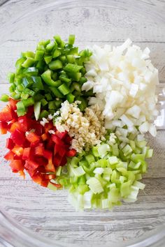 chopped up vegetables in a glass bowl