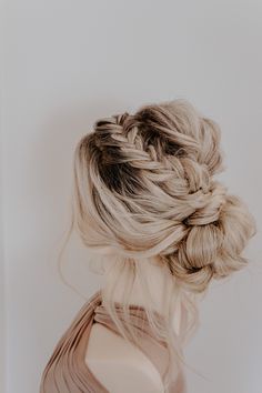 a woman with blonde hair in a braid