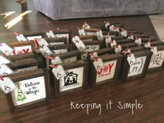 there are many small wooden boxes with tags on them that say, keep it simple