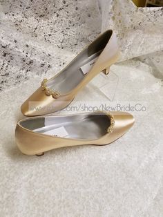 "Beautiful elegant pump style shoes, for the minimalist bride who loves chic shoes! HEEL: 1 3/4\" Please look at the pictures for details such as the gold tone bling brooches adding a very special Elegant & Chic touch. COLOR AVAILABLE: Champagne, Silver, White, Off-White, Ivory SIZES AVAILABLE: M (Medium width) 5, 5.5, 6, 6.5, 7, 7.5, 8, 8.5, 9, 9.5, 10, 11, 12. W (Wide width) 6W, 6.5W, 7W, 7.5W, 8W, 8.5W, 9W, 9.5W, 10W, 11W, 12W. Color swatches available, computer screens make color vary, I Chiffon White Dress, Elegant Pumps, Minimalist Bride, Low Heel Pumps, Short Heels, Gold Pumps, Satin Shoes, Chic Shoes, 4 Inch Heels