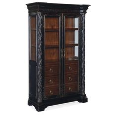 an ornate wooden cabinet with glass doors and drawers on the front, in dark wood