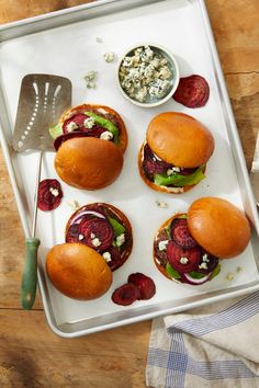 three sliders with beets, lettuce and feta cheese