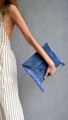 "Medusa Clutch in raf blue. An adorable leather clutch with fringes for beautiful fashion looks. This envelope clutch is ideal to carry anything you might need! A handmade clutch from Italian genuine suede leather in raf blue colour and silk fringes. The interior is fully lined with gray leatherette. It closes with one metal rivet stud in silver or gold. The pictures show the clutch with gold stud. Dimensions: Height 23 cm (9,06\"), Length 32 cm (12,6\") Do you want to use your clutch as a shoul Chic Fringe Clutch For Parties, Chic Clutch With Tassels, Chic Clutch Bag With Tassels, Chic Tassel Clutch Bag, Fringe Evening Clutch In Rectangular Shape, Blue Envelope Clutch For Everyday Use, Chic Blue Pouch Clutch, Rectangular Fringe Clutch For Evening, Evening Rectangular Fringe Clutch