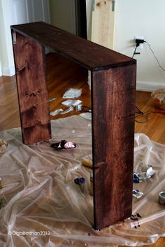 a wooden structure sitting on top of a hard wood floor