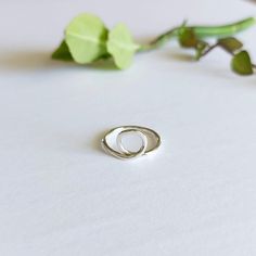 This unique small loop circle ring is handmade with precision and care, and crafted from high-quality sterling silver.  Its simple yet elegant design makes it perfect for everyday wear, adding a touch of sophistication to any outfit. The durable material ensure that this ring will last for years to come, becoming a cherished piece in your jewelry collection.  Whether you're dressing up or keeping it casual, this handmade sterling silver ring is the perfect accessory for any occasion.  *Great for Handmade Minimalist Rings For Everyday, Minimalist Sterling Silver Stackable Rings For Anniversary, Adjustable Hoop Rings For Everyday, Handmade Minimalist Midi Rings For Anniversary, Minimalist Sterling Silver Promise Ring, Everyday Minimalist Handmade Stackable Rings, Minimalist Sterling Silver Stackable Rings For Promise, Adjustable Minimalist Sterling Silver Rings, Minimalist Sterling Silver Midi Rings For Anniversary