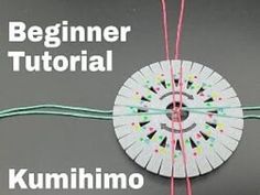 the instructions for how to make an origami fan with string and yarn on it