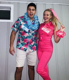 a man and woman are dressed up in pink