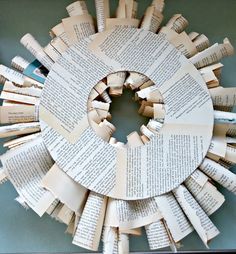 a circular sculpture made out of book pages