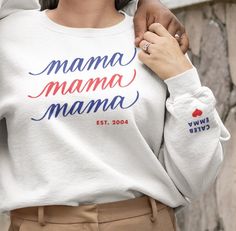 Thoughtful gift for mom. Personalize the front with EST. year and left sleeve with the names of the children and/or loved ones to make it even more unique and special. PRODUCT DETAILS * Crewneck Sweater, 50% cotton, 50% polyester * Unisex Sizing: S, M, L, XL, 2XL Care Instructions: Machine wash cold. Tumble dry low or hang to dry. Wash inside out. Do not iron or dry clean. SHIPPING AND TURN AROUND * This product is personalized and made especially for you as soon as you place an order * Orders a Kids Names, New Mom Gift, Sweatshirt For Women, Mama Sweatshirt, Mom Sweatshirt, New Mom, Personalised Kids, Gifts For New Moms, Mom Gift