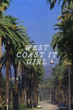 a palm tree lined street with the words west coast girl