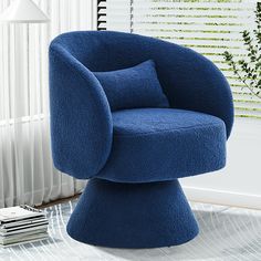 a blue chair sitting on top of a glass table