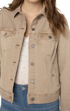 Classic jean jacket gets an update in our beautiful Hayseed Tan wash! Your go-to layering item that adds the perfect touch to any outfit made with comfortable fabric that won’t stretch out! 23" HPS Two front flap pockets Two seam side pockets 6-button front closure Silver metal buttons 58% Cotton, 32% Tencel, 8% T400, 2% Spandex Biscuit Tan, Liverpool Jeans, Short Loungewear, Classic Denim Jacket, Classic Jeans, Womens Size Chart, Jacket Sale, Ladies Boutique, Sweater Jacket